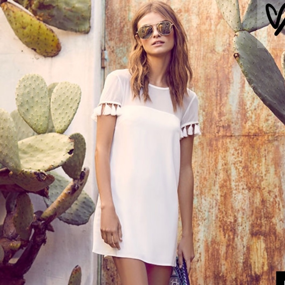White dress with Pom Pom sleeves!